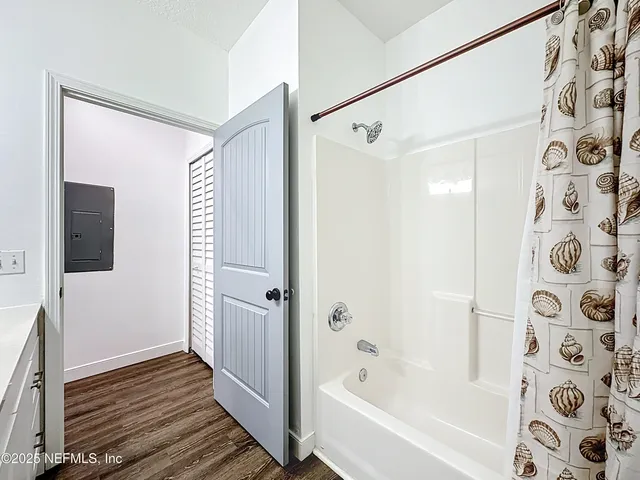 a bathroom with a bathtub and a shower