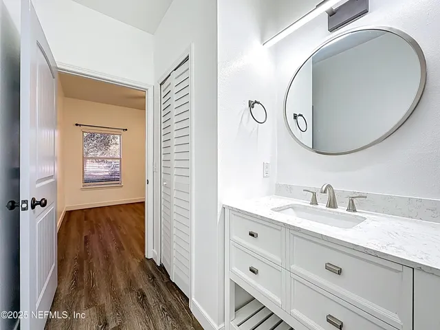 a bathroom with a sink and a mirror