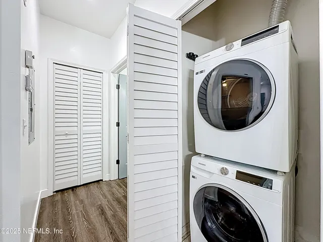 a view of a hallway with washer and dryer
