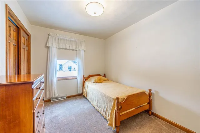 a bathroom with a granite countertop sink toilet mirror and bathtub