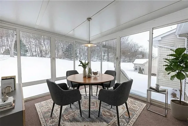 a view of a dining room with furniture window and outside view