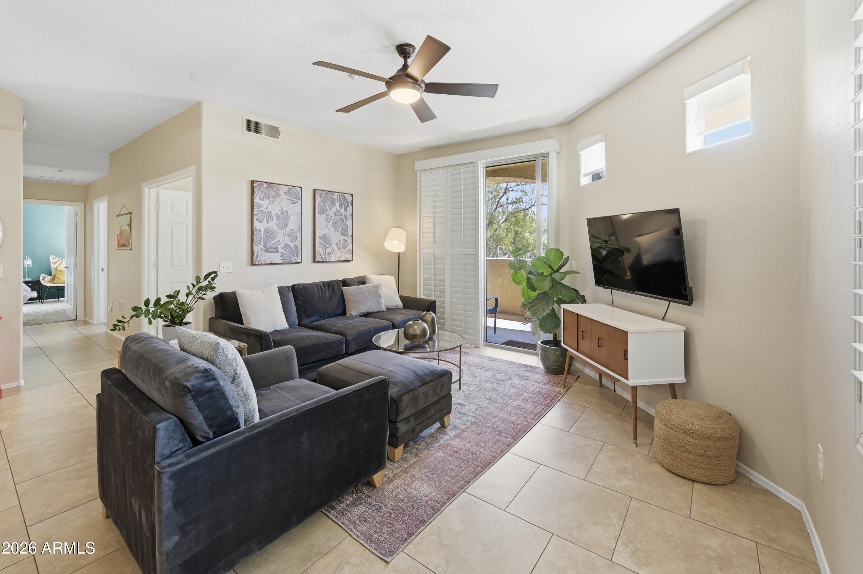 5303 North 7th Street, Unit 220 Phoenix, AZ 85014 - Photo 9 of 33 a living room with furniture and a flat screen tv
