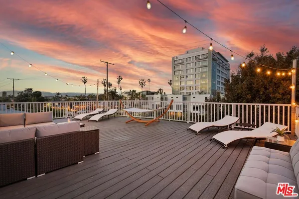 a view of roof deck with patio