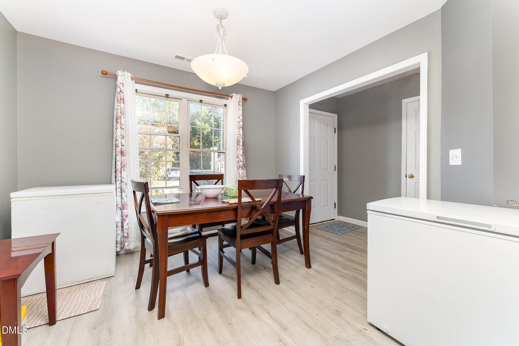 4004 Grandover Drive Raleigh, NC 27610 - Photo 4 of 7 a dining room with furniture and wooden floor