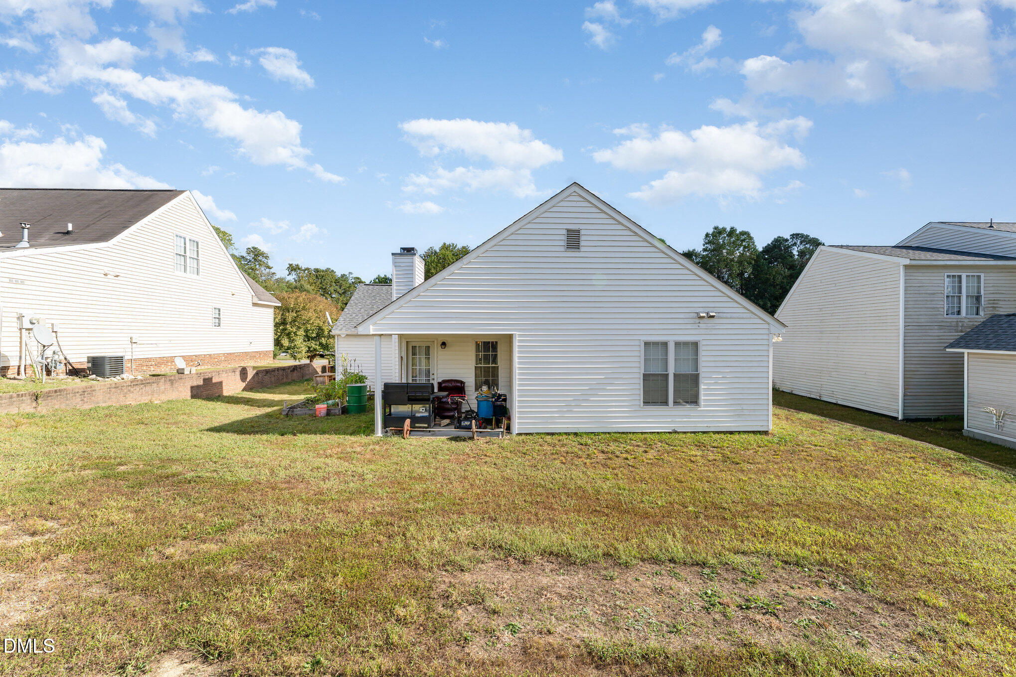 4004 Grandover Drive Raleigh, NC 27610 - Photo 5 of 7 a view of a house with a yard