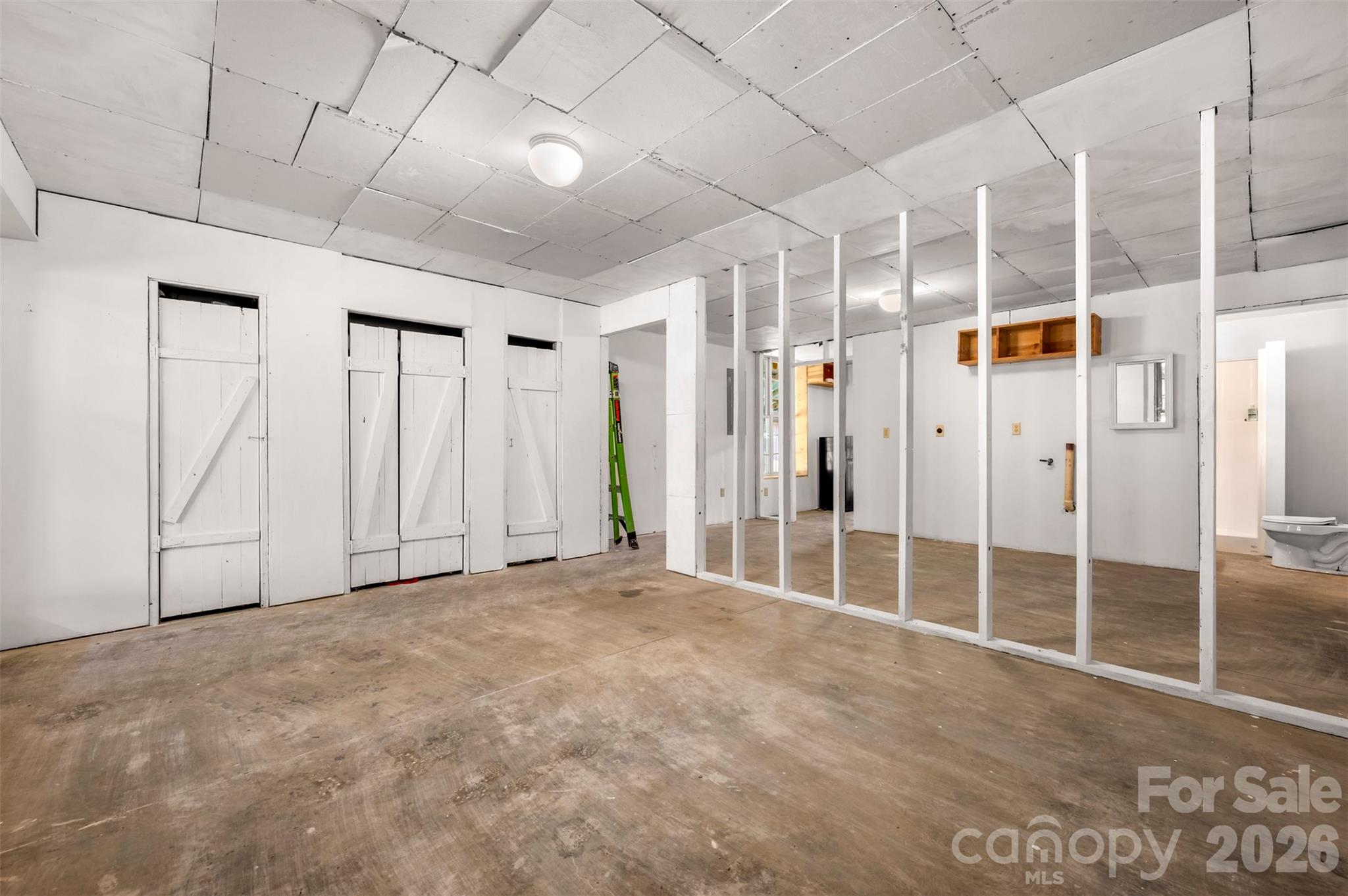 340 Right Prong Road Ellenboro, NC 28040 - Photo 5 of 28 a view of empty room with wooden floor and windows