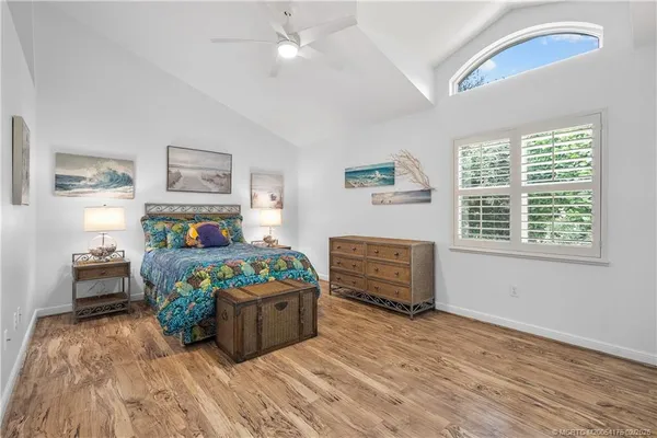 a bedroom with furniture and a window