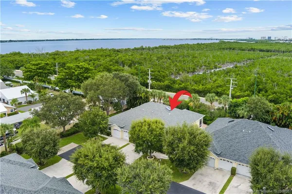 a backyard of a house with lots of green space and mountain view in back