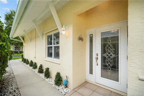 a front view of a house with a glass door