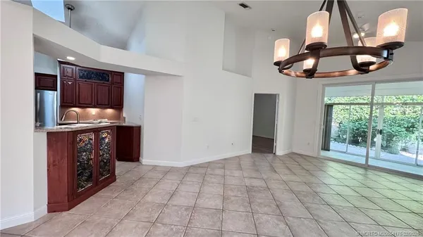 a kitchen with stainless steel appliances granite countertop a stove a sink and a cabinets
