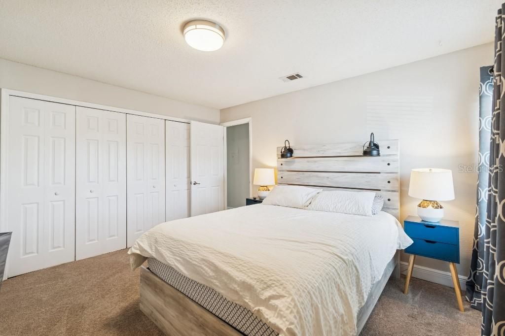 13125 Wilcox Road, Unit 6205 Largo, FL 33774 - Photo 20 of 48 a bedroom with a bed and a closet