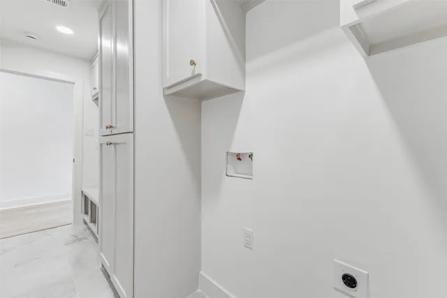 a bathroom with a shower and a sink