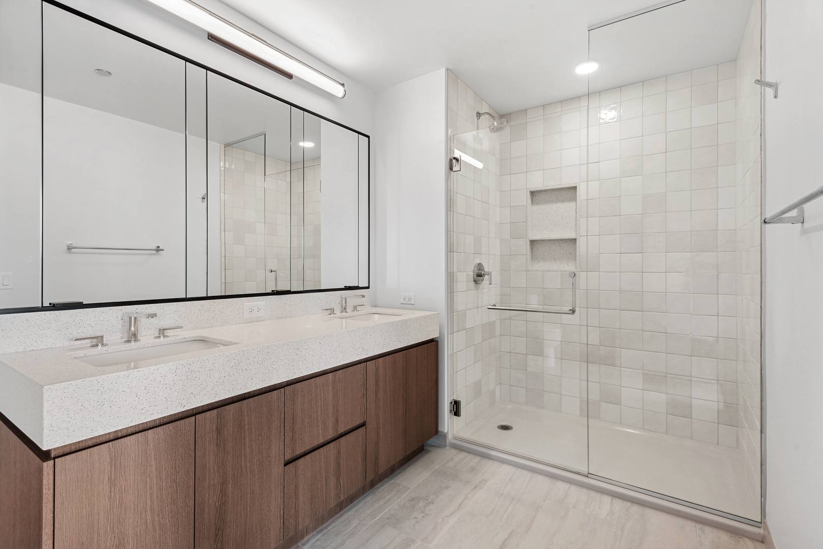 164 North Peoria Street, Unit 4004 Chicago, IL 60607 - Photo 24 of 32 a bathroom with a sink double vanity and shower