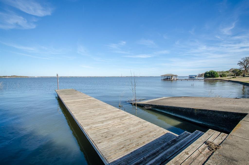 Lot 90 Vista Ridge Corsicana, TX 75109 - Photo 33 of 35 a view of a terrace with wooden floor and seating space