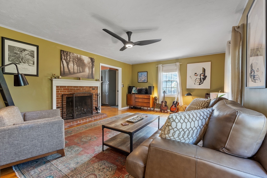 583 Great Road Stow, MA 01775 - Photo 19 of 41 a living room with furniture and a fireplace