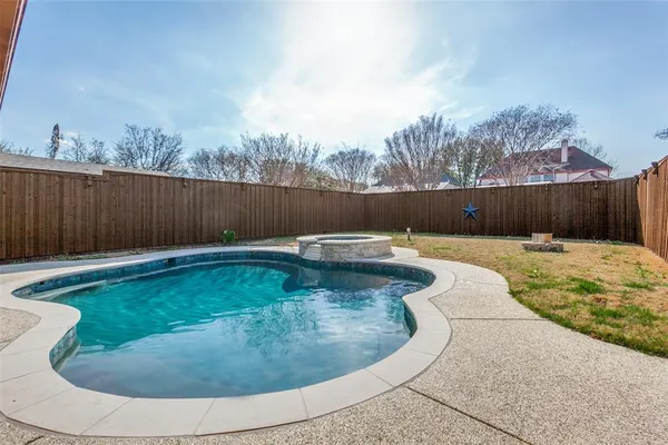 a view of swimming pool having outdoor seating