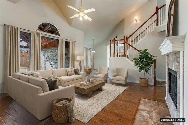 a living room with furniture fireplace and flat screen tv