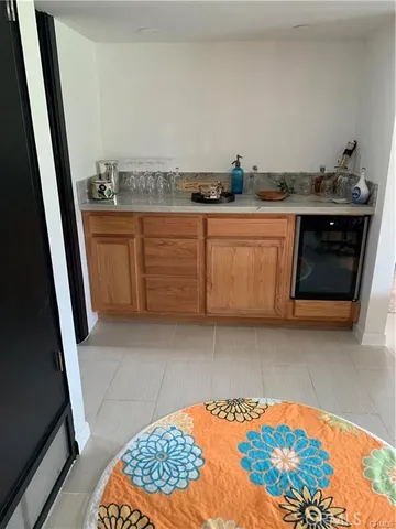 a bedroom with a bed and a mirror