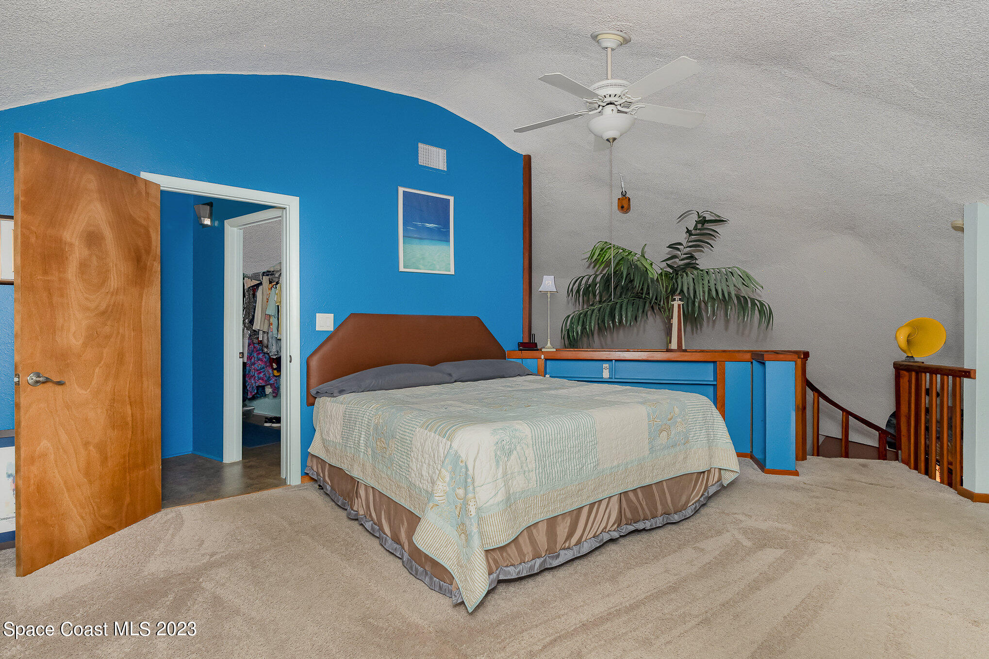 2025 Cox Road Cocoa, FL 32926 - Photo 26 of 49 a bedroom with a bed and a chandelier