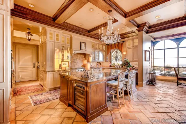 a large white kitchen with lots of counter top space