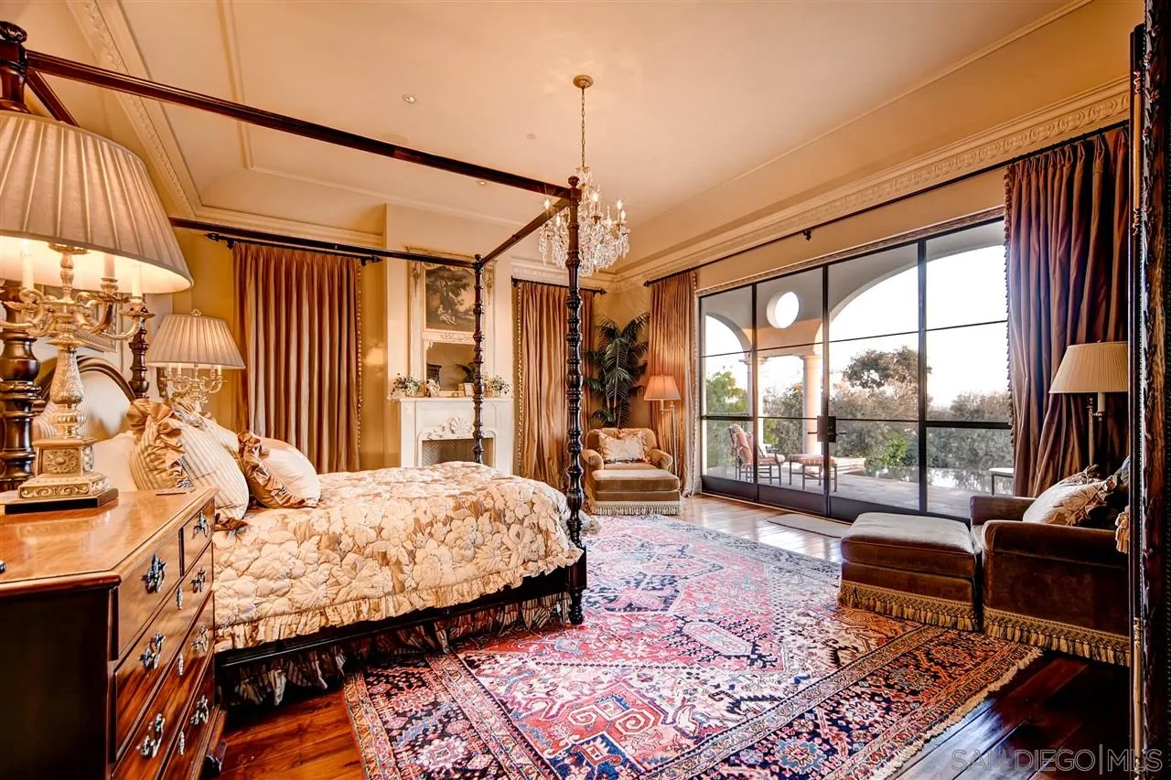 5806 Bucknell Avenue La Jolla, CA 92037 - Photo 16 of 25 a bedroom with a bed a large window and walk in closet