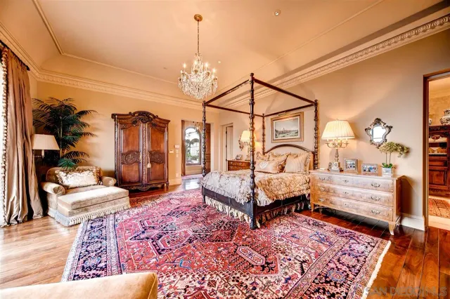 a room with lots of furniture and wooden floors