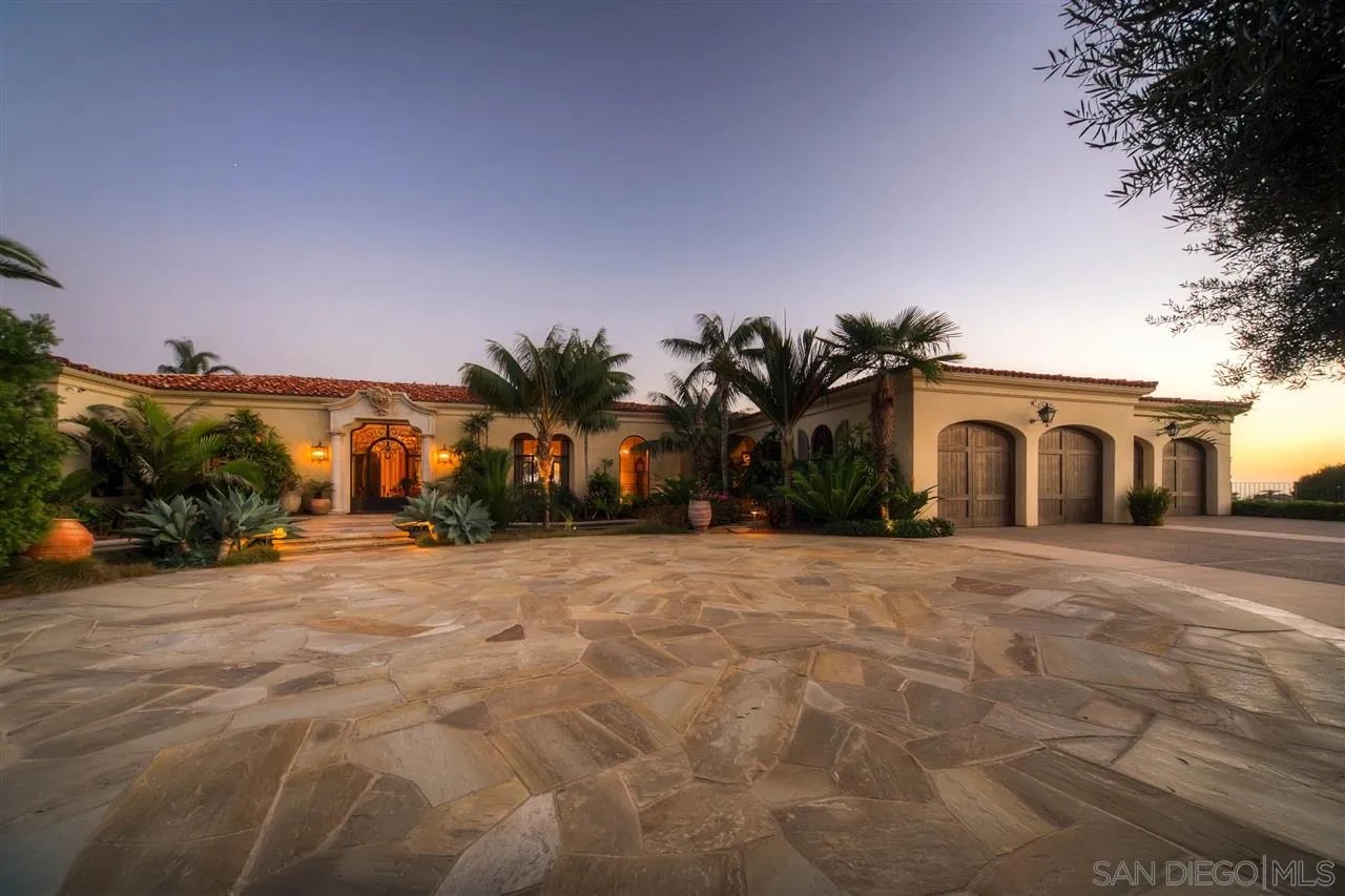 5806 Bucknell Avenue La Jolla, CA 92037 - Photo 8 of 25 a front view of a house with a yard and a garage