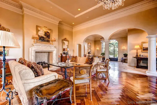 a very nice looking room with many windows and furniture