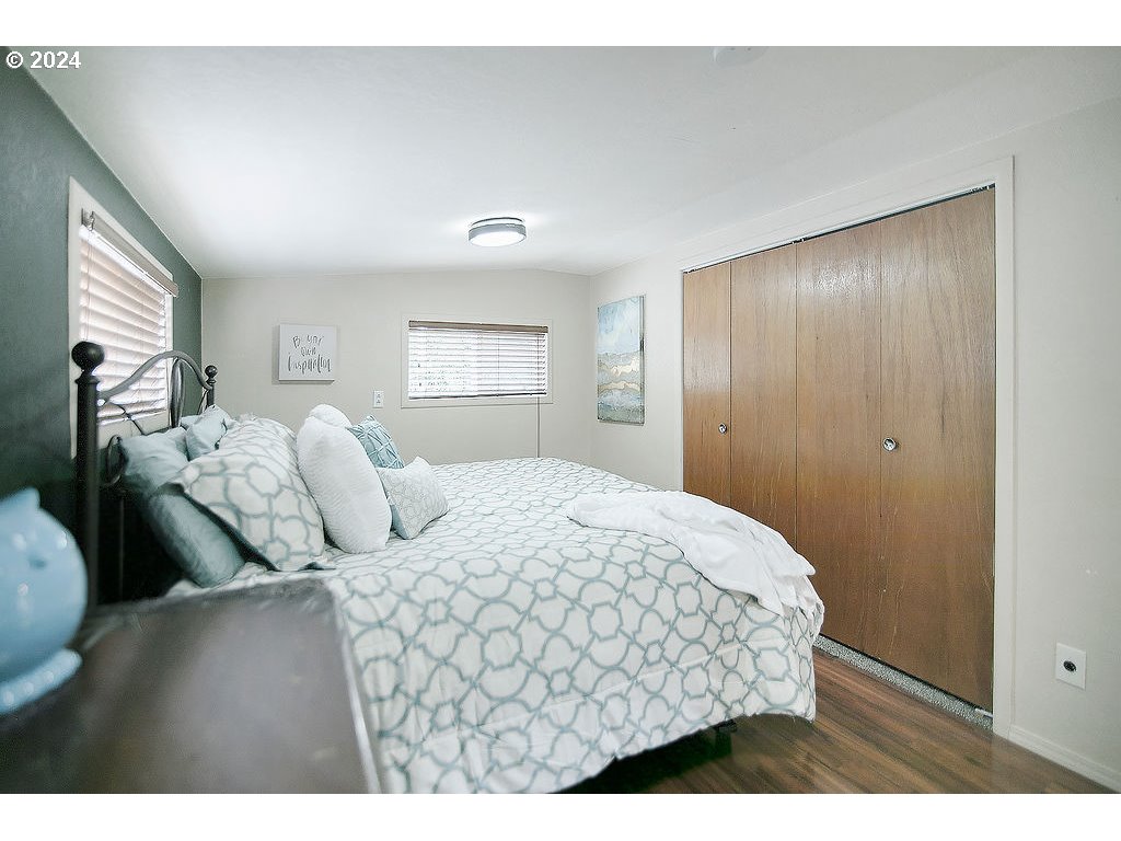 115 Stewart Creek Road Longview, WA 98632 - Photo 19 of 31 a bedroom with a bed and a night stand