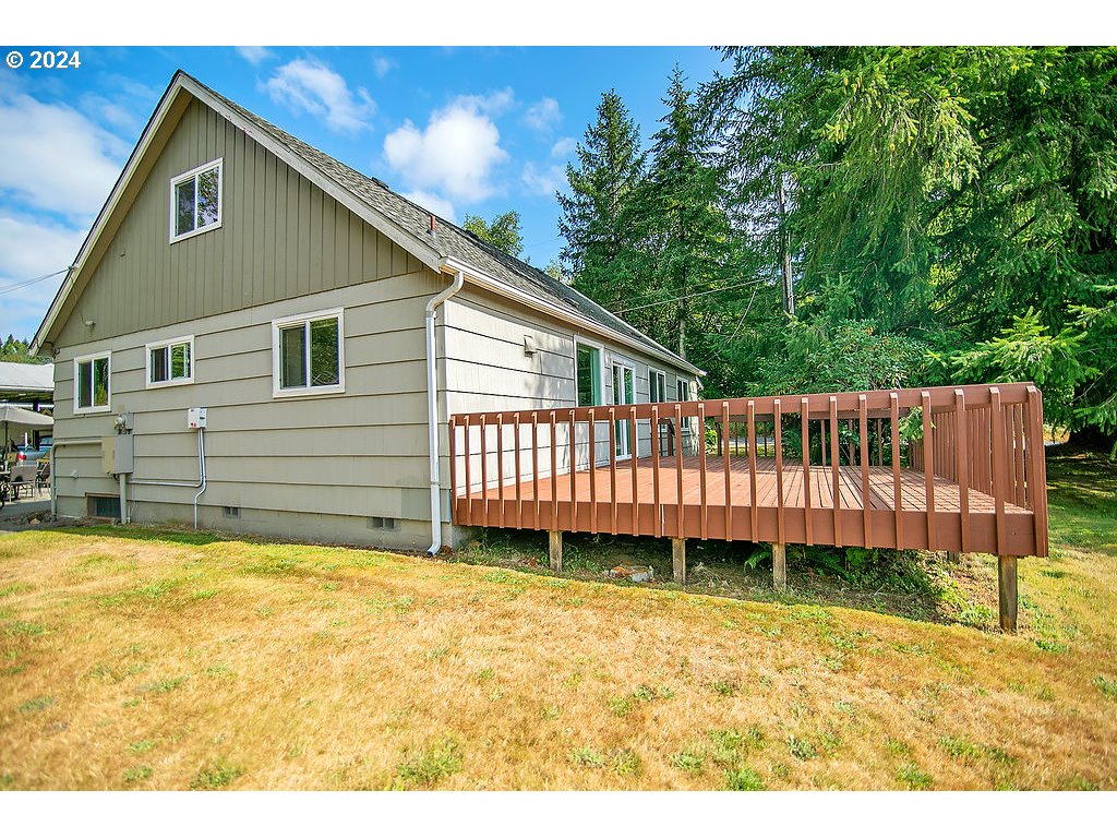 115 Stewart Creek Road Longview, WA 98632 - Photo 30 of 31 a backyard of a house with a garden and deck