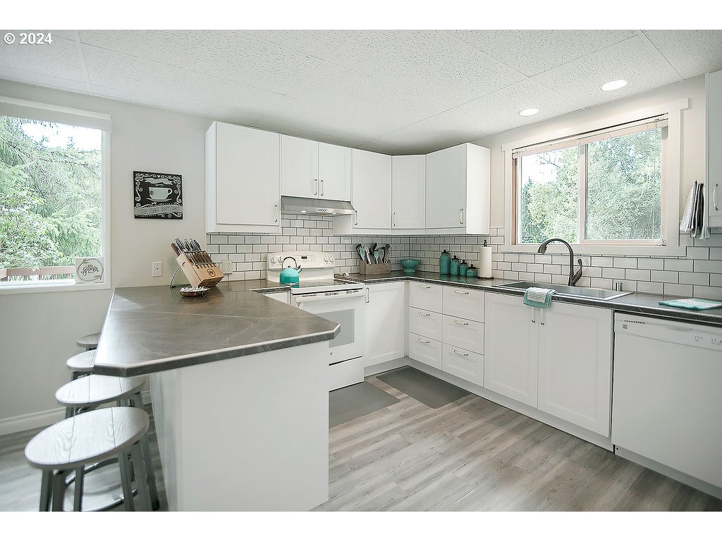 115 Stewart Creek Road Longview, WA 98632 - Photo 10 of 31 a kitchen with a sink cabinets and window