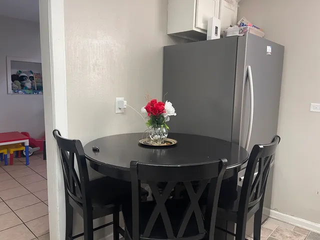 a living room with furniture and a lamp