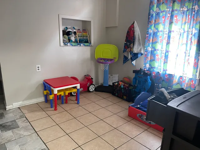 a kitchen with granite countertop a stove and a microwave