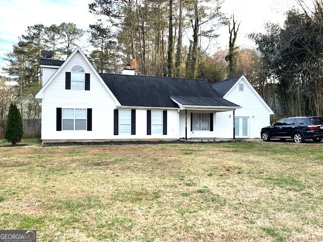 50 Flakes Road Stockbridge, GA 30281 - Photo 1 of 1 a front view of a house with a garden