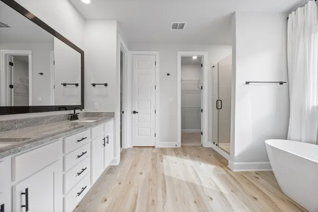 a bathroom with a granite countertop sink mirror and double