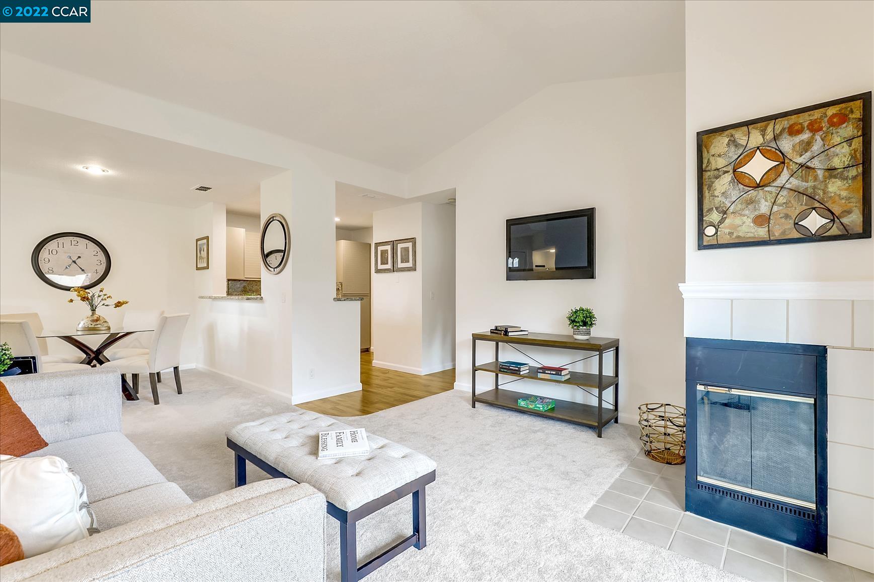 7003 Stagecoach Road, Unit G Dublin, CA 94568 - Photo 1 of 1 a living room with furniture and a flat screen tv