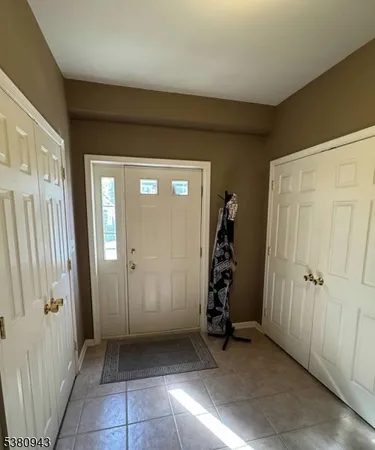 an entryway view with a wooden door
