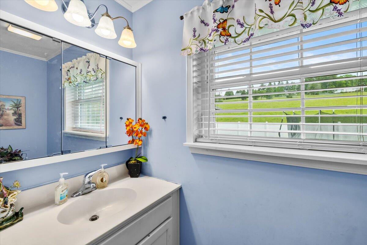 623 Kunkletown Road Kunkletown, PA 18058 - Photo 28 of 37 a bathroom with a sink a mirror and a window with the outer view