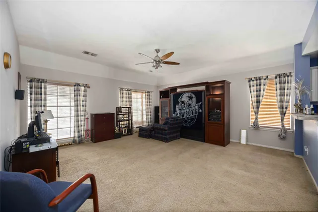 a living room with furniture and a window