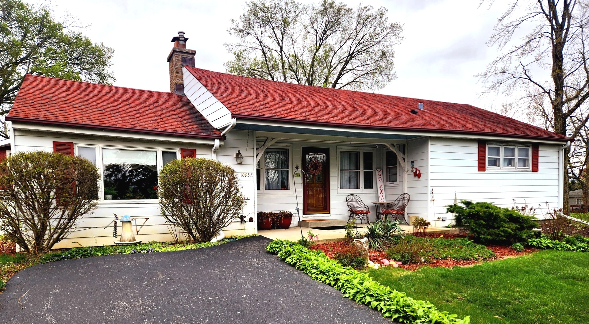a view of house with outdoor seating area