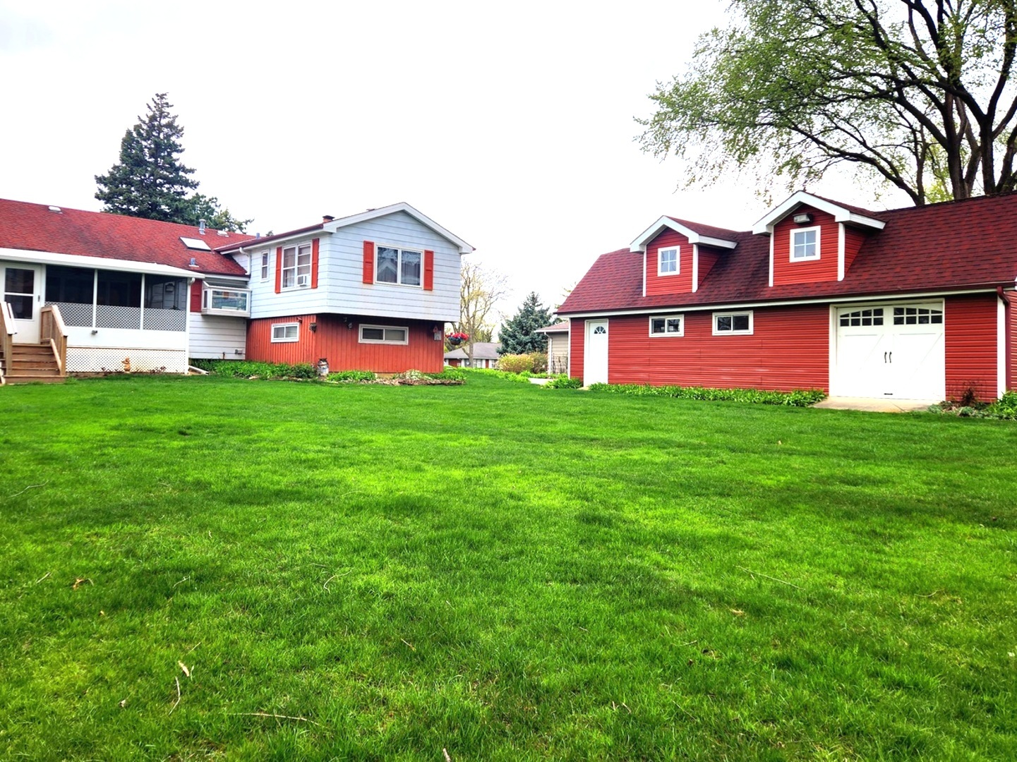 1095 South Prospect Avenue Elmhurst, IL 60126 - Photo 51 of 54 a view of a house with a big yard and large trees
