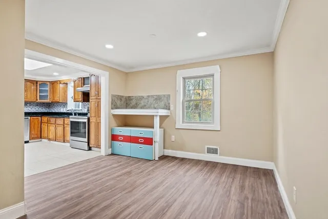 a view of a dining room with furniture and wooden floor