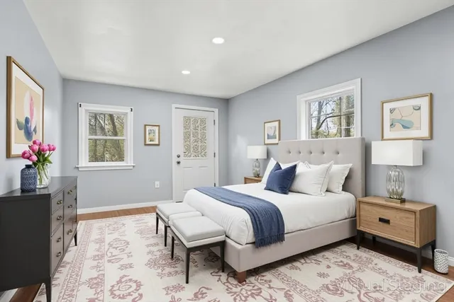 a view of room with window and wooden floor