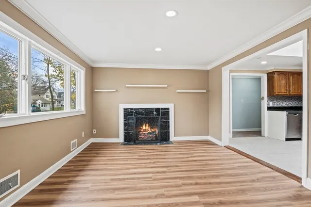 a kitchen with granite countertop a refrigerator and a stove top oven