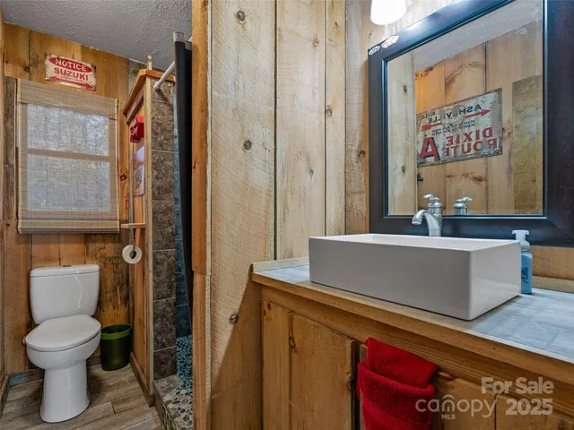 a bathroom with a toilet and a sink