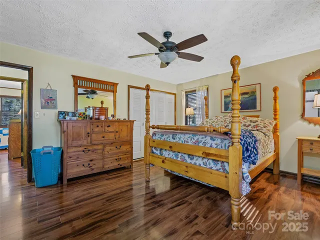 a bed room with a bed and window