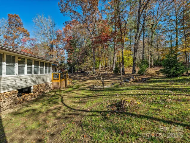 a swimming pool with outdoor seating and yard