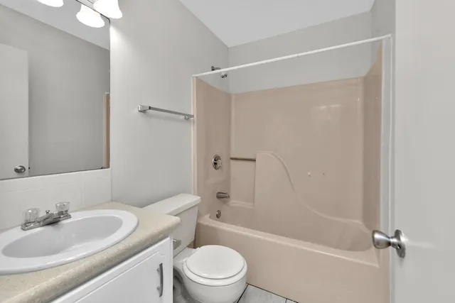 a bathroom with a sink a toilet and a bathtub