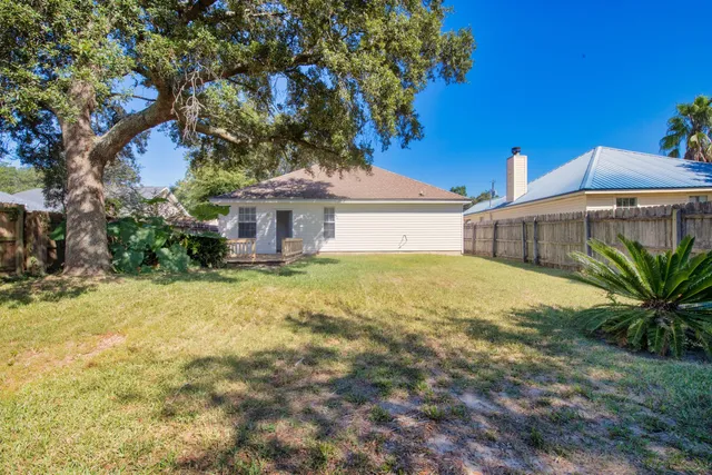 a house with a tree in front of it
