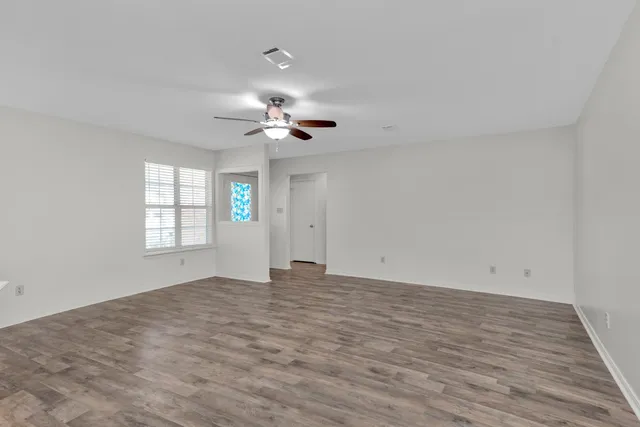 a view of an empty room with a window